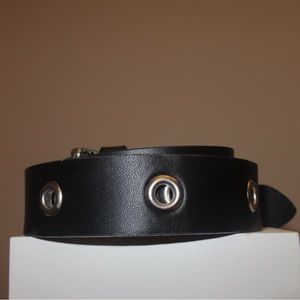 Black leather belt with silver metal hoops